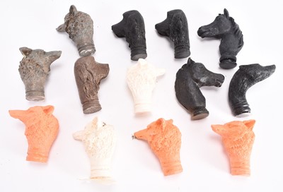 Lot 7 - A collection of cast resin animal stick heads