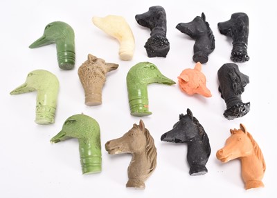 Lot 68 - A collection of cast resin animal stick heads