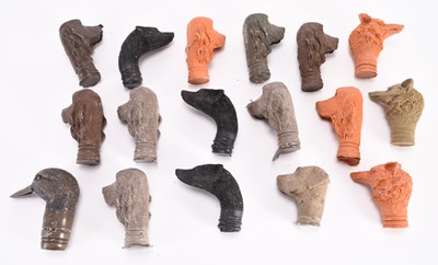 Lot 112 - A collection of cast resin animal stick heads