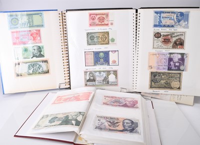 Lot 305 - Three albums of UK and foreign banknotes together with seven framed banknotes