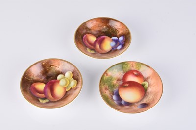 Lot 555 - A set of three Royal Worcester fruit-decorated pin dishes