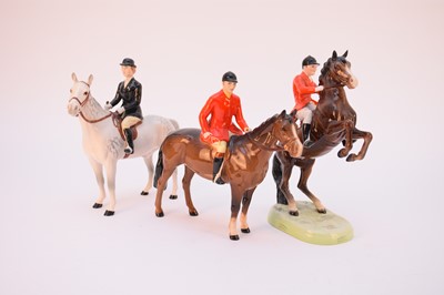 Lot 558 - A Beswick hunting set including three riders, three foxes, fifteen hounds