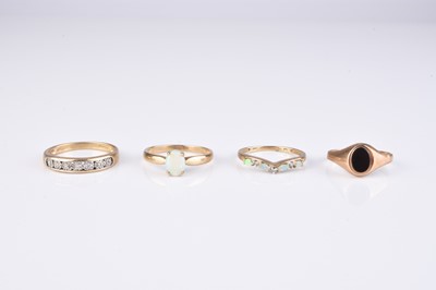 Lot 238 - A collection of four 9ct gold stone set rings