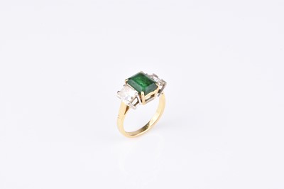 Lot 149 - An 18ct gold three stone emerald and diamond ring