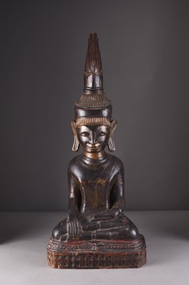 Lot 252 - A large South East Asian carved and lacquered wood figure of a seated Buddha, 18th/19th century