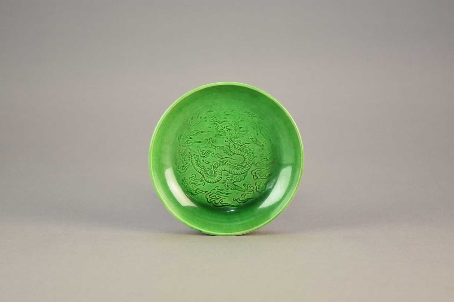 Lot 16 - A Chinese Langyao type green glazed dragon dish, probably Kangxi