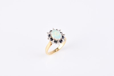 Lot 147 - An 18ct gold opal, sapphire and diamond ring