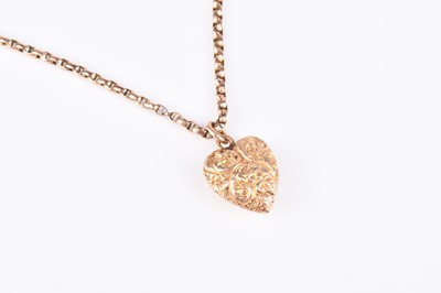 Lot 145 - A yellow metal heart shaped pendant on chain