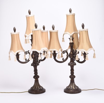 Lot 101 - A pair of cast alloy three-branch table lamps, late 20th century