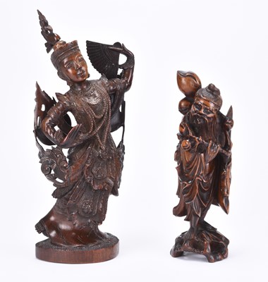 Lot 46 - A Chinese carved wood figure of Shoulao and a Thai figure of a dancer