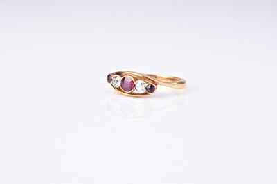 Lot 220 - A five stone graduated ruby and diamond ring