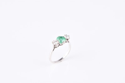 Lot 121 - A graduated three stone emerald and diamond ring