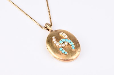 Lot 236 - A late 19th century turquoise and split pearl oval locket suspended on chain