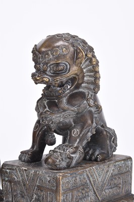 Lot 201 - A pair of Chinese bronze guardian lions