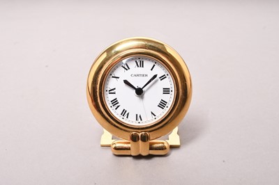 Lot 312 - Cartier: A gilt brass desk alarm clock, boxed