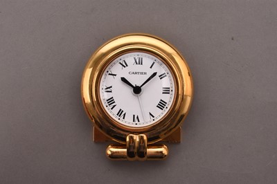 Lot 312 - Cartier: A gilt brass desk alarm clock, boxed