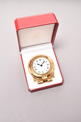 Lot 312 - Cartier: A gilt brass desk alarm clock, boxed