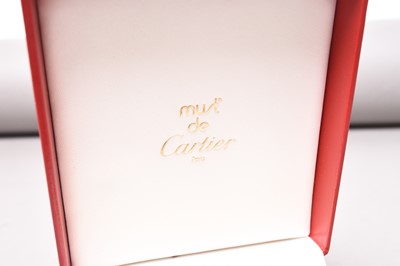 Lot 312 - Cartier: A gilt brass desk alarm clock, boxed