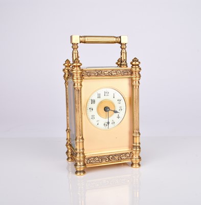 Lot 66 - A French early 20th century gilt brass carriage timepiece