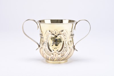 Lot 14 - A George II silver gilt porringer