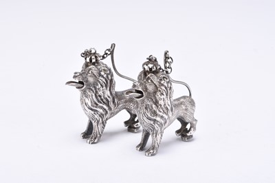 Lot 7 - Two white metal lion mounts