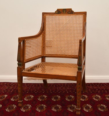 Lot 91 - A 19th century caned and painted satinwood armchair