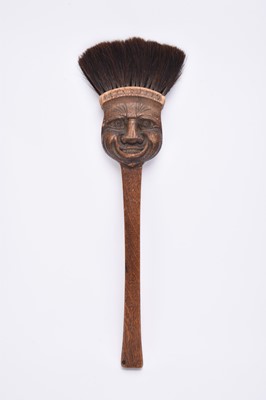 Lot 205 - An American carved oak fire broom, attributed to Biltmore Industries