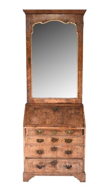 Lot 86 - A George II feather-banded walnut bureau cabinet