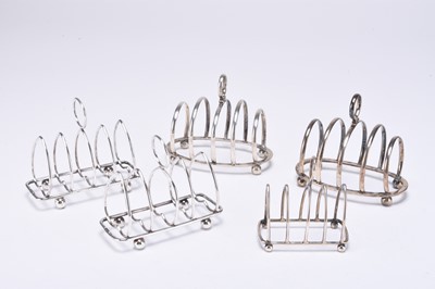 Lot 85 - A collection of five silver toast racks