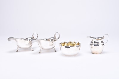 Lot 42 - Two silver sauce boats, a cream jug and a sugar bowl