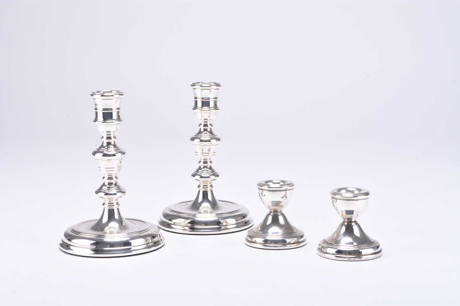 Lot 9 - Two pairs of silver candlesticks