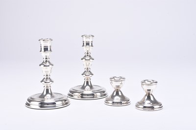 Lot 9 - Two pairs of silver candlesticks