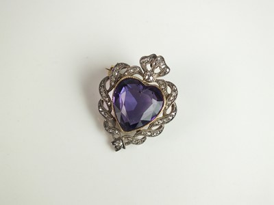 Lot 139 - A late 19th century amethyst and diamond heart shaped brooch / pendant