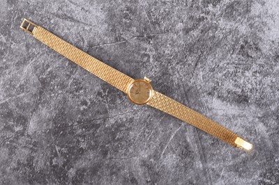 Lot 380 - Omega: A lady's 18ct gold bracelet watch