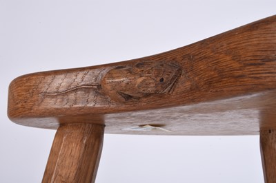 Lot 122 - Robert Mouseman Thompson, Studio of, an oak three-legged 'cow' stool