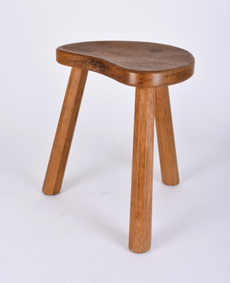 Lot 122 - Robert Mouseman Thompson, Studio of, an oak three-legged 'cow' stool