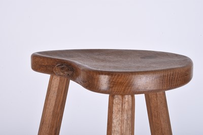 Lot 122 - Robert Mouseman Thompson, Studio of, an oak three-legged 'cow' stool