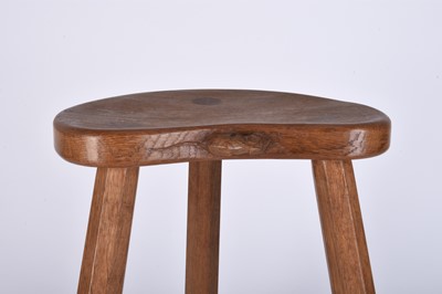 Lot 122 - Robert Mouseman Thompson, Studio of, an oak three-legged 'cow' stool