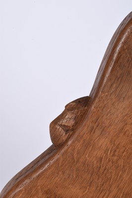 Lot 122 - Robert Mouseman Thompson, Studio of, an oak three-legged 'cow' stool