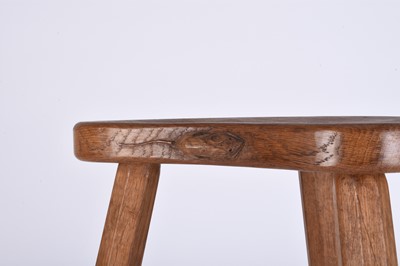 Lot 122 - Robert Mouseman Thompson, Studio of, an oak three-legged 'cow' stool