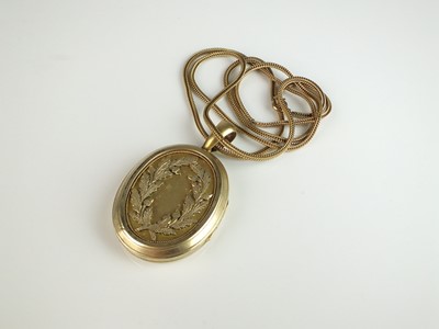 Lot 308 - A 19th century yellow metal oval locket