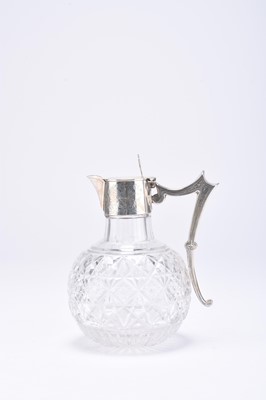 Lot 28 - A Victorian silver mounted glass claret jug