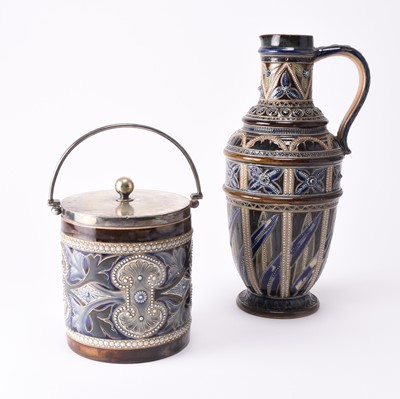 Lot 39 - A Doulton Lambeth jug by Frank Butler together with a Doulton Lambeth biscuit jar