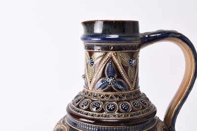 Lot 39 - A Doulton Lambeth jug by Frank Butler together with a Doulton Lambeth biscuit jar