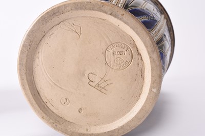 Lot 39 - A Doulton Lambeth jug by Frank Butler together with a Doulton Lambeth biscuit jar