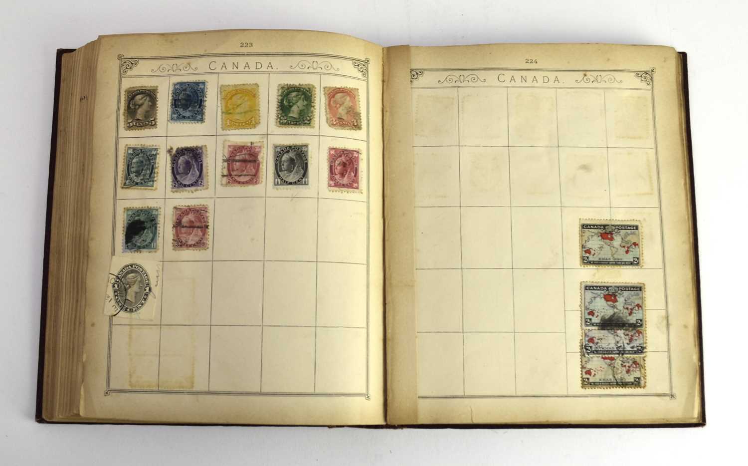 Lot 388 - An old Lincoln album moderately filled. Noted: GB 1d Black