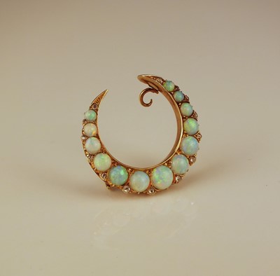 Lot 141 - A late 19th / early 20th century opal and diamond crescent brooch