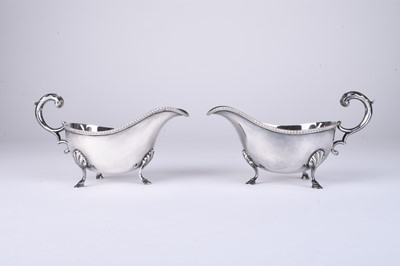 Lot 1 - A pair of silver sauce boats by Harrods Ltd