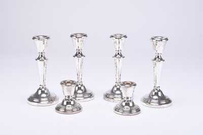 Lot 86 - A collection of six silver mounted candlesticks