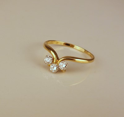 Lot 205 - An 18ct gold three stone diamond ring